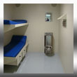 Jail Cell with custom fabricated wall mounted shelf, custom metal wall mounted bunks with under bunk shelfing and custom fabricated cell wall vents